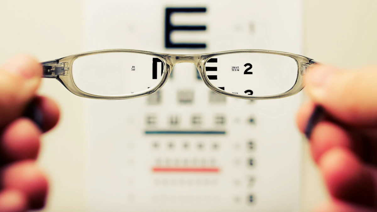 Eyeglasses held up in front of a vision test chart