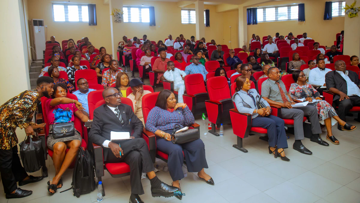 Presenter addressing a full auditorium during a wellness awareness talk