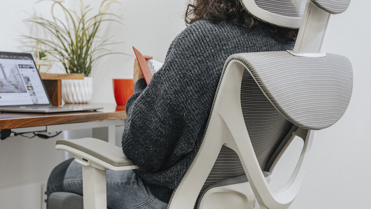 Employee sitting in a supportive ergonomic office chair at a well-organised desk